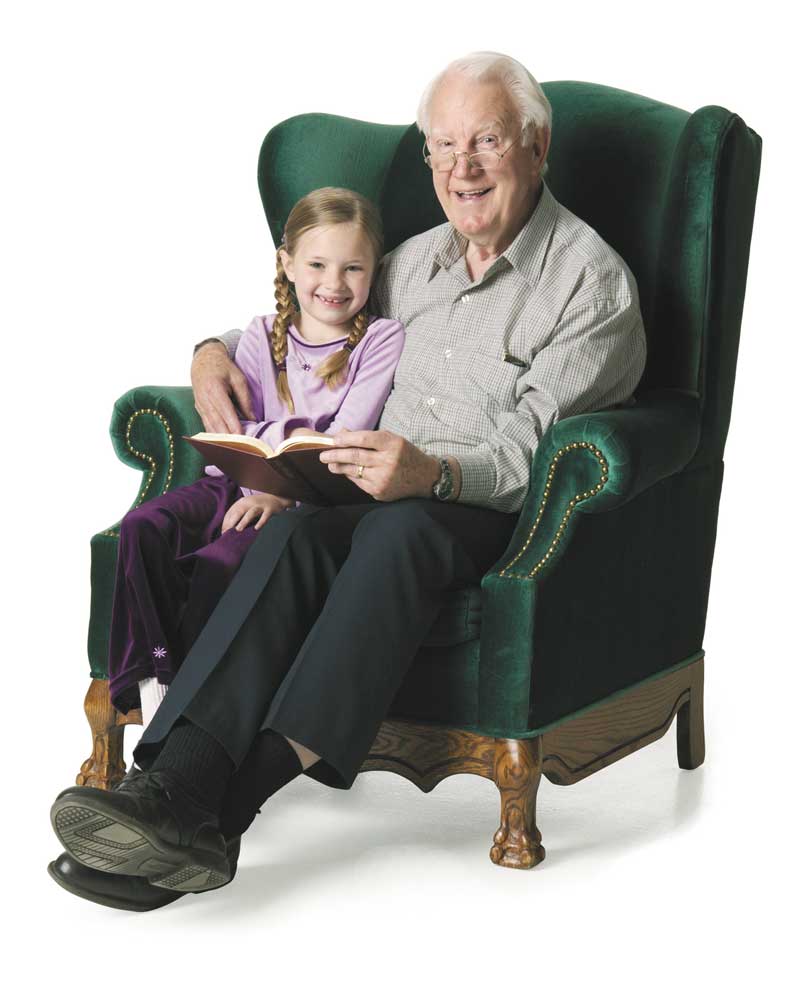 Grandfather and grandaughter in chair